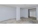 Empty room featuring unfinished floors and walls with white trim and paint at 201 Smithstone Path, Fayetteville, GA 30214