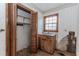 Room featuring a closet, sink and vanity, and natural light from the window at 201 Smithstone Path, Fayetteville, GA 30214