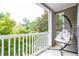 Relaxing balcony includes hanging chair and scenic views of surrounding trees at 2700 Pine Tree Ne Rd # 2204, Atlanta, GA 30324