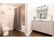 Full bathroom features a granite vanity, tub and shower with curtain, and a toilet at 2700 Pine Tree Ne Rd # 2204, Atlanta, GA 30324