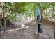 Community dog park with chairs and waste disposal station at 2700 Pine Tree Ne Rd # 2204, Atlanta, GA 30324