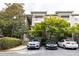 Apartment building with a parking lot and mature landscaping at 2700 Pine Tree Ne Rd # 2204, Atlanta, GA 30324