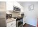 Updated kitchen features stainless steel appliances, granite countertops, and white cabinets at 2700 Pine Tree Ne Rd # 2204, Atlanta, GA 30324