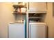 Convenient laundry room with front loading washer and dryer, plus storage at 2700 Pine Tree Ne Rd # 2204, Atlanta, GA 30324