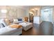 Cozy living room with a sectional sofa, ottoman coffee table, and view to the kitchen at 2700 Pine Tree Ne Rd # 2204, Atlanta, GA 30324