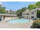 Stunning community pool area with lush landscaping and a stylish building facade in the background at 2700 Pine Tree Ne Rd # 2204, Atlanta, GA 30324