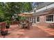 Beautiful brick home with French doors leading to a spacious back deck, perfect for enjoying the outdoors and entertaining guests at 4105 Peachtree Dunwoody Ne Rd, Atlanta, GA 30342
