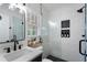 Updated bathroom featuring white subway tile shower with black fixtures, and modern vanity at 4105 Peachtree Dunwoody Ne Rd, Atlanta, GA 30342