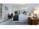 Serene bedroom with bay window and dark wood furniture and wood paneled walls at 4105 Peachtree Dunwoody Ne Rd, Atlanta, GA 30342