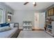 Cozy bedroom with a twin bed, shelving, and a window providing natural light at 4105 Peachtree Dunwoody Ne Rd, Atlanta, GA 30342