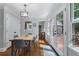 Dining area with natural light, hardwood floors, and views to the outdoor patio at 4105 Peachtree Dunwoody Ne Rd, Atlanta, GA 30342