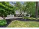 Charming brick home with a well-manicured front yard and mature trees at 4105 Peachtree Dunwoody Ne Rd, Atlanta, GA 30342