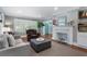 Bright living room with fireplace, hardwood floors, and a comfortable seating arrangement at 4105 Peachtree Dunwoody Ne Rd, Atlanta, GA 30342
