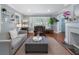 Inviting living room with fireplace, hardwood floors, and a comfortable seating arrangement at 4105 Peachtree Dunwoody Ne Rd, Atlanta, GA 30342