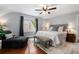 Large main bedroom featuring hardwood floors, neutral walls, seating area, and bright windows at 4105 Peachtree Dunwoody Ne Rd, Atlanta, GA 30342