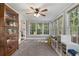 Sunroom with large windows offering great natural light, carpeted floor, and backyard views at 4105 Peachtree Dunwoody Ne Rd, Atlanta, GA 30342