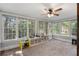 Bright sunroom with lots of natural light, carpeted floor, and great backyard views at 4105 Peachtree Dunwoody Ne Rd, Atlanta, GA 30342