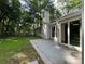Spacious backyard with a concrete patio, a lush lawn, and a fenced perimeter for privacy at 520 Cranberry Pl, Roswell, GA 30076