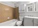 This bathroom features a white vanity with gray cabinets and a tiled bath and shower at 520 Cranberry Pl, Roswell, GA 30076