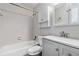 The bathroom features a shower-tub combination, updated sink and vanity, and medicine cabinet at 520 Cranberry Pl, Roswell, GA 30076