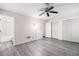 The spacious bedroom boasts a ceiling fan, three closets and easy access to an ensuite bathroom at 520 Cranberry Pl, Roswell, GA 30076