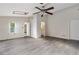 Spacious bedroom featuring luxury vinyl plank flooring, ceiling fan, and a light-filled skylight at 520 Cranberry Pl, Roswell, GA 30076