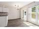 Eat-in kitchen area with ample light and a slider to the outside at 520 Cranberry Pl, Roswell, GA 30076