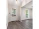 Charming entryway with gray floors, bright lighting, and a white front door with window at 520 Cranberry Pl, Roswell, GA 30076