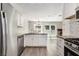 Spacious kitchen features granite countertops, stainless steel appliances, and open layout at 520 Cranberry Pl, Roswell, GA 30076