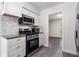 The kitchen showcases stainless steel appliances, granite countertops, and a mosaic backsplash at 520 Cranberry Pl, Roswell, GA 30076