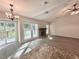 An eat-in kitchen sits adjacent to the living room and features stainless steel appliances and stone counters at 520 Cranberry Pl, Roswell, GA 30076