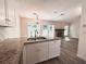 Eat-in kitchen with granite counters overlooks the living room with its lovely stone fireplace at 520 Cranberry Pl, Roswell, GA 30076