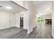 Open-concept living area with a fireplace, sleek floors, and ample natural light at 520 Cranberry Pl, Roswell, GA 30076