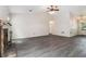 Cozy living room boasts a beautiful fireplace, ample space, and stylish wood floors at 520 Cranberry Pl, Roswell, GA 30076