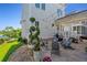 A charming back patio with string lights, elegant pavers, and comfortable outdoor seating, perfect for relaxation at 7120 Lullwater Rd, Cumming, GA 30040
