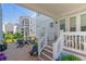 Charming backyard with lounge chairs, string lights, and a beautiful neighborhood view at 7120 Lullwater Rd, Cumming, GA 30040