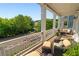 Charming balcony featuring comfortable seating, and picturesque views of the peaceful neighborhood, ideal for relaxation at 7120 Lullwater Rd, Cumming, GA 30040