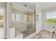 Modern bathroom showcasing a glass-enclosed shower, stylish tile work, and a built-in seat for added convenience at 7120 Lullwater Rd, Cumming, GA 30040