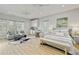 Cozy bedroom with a seating area, kitchenette, and bright natural light at 7120 Lullwater Rd, Cumming, GA 30040