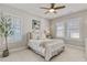 Cozy bedroom with natural light, neutral color scheme, creating a serene and relaxing atmosphere at 7120 Lullwater Rd, Cumming, GA 30040