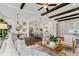 Bright and airy living space showing an open floorplan to the kitchen and dining area at 7120 Lullwater Rd, Cumming, GA 30040