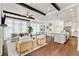 Open-concept living space featuring the living room, kitchen and dining areas at 7120 Lullwater Rd, Cumming, GA 30040