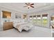 Serene main bedroom with a private balcony and large windows at 7120 Lullwater Rd, Cumming, GA 30040