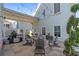 Cozy backyard patio with a grill, comfortable seating, and decorative plants, perfect for outdoor gatherings and relaxation at 7120 Lullwater Rd, Cumming, GA 30040