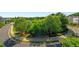 Neighborhood street featuring lush greenery and landscaping, offering serene views for a tranquil living environment at 7120 Lullwater Rd, Cumming, GA 30040