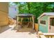 Outdoor wooden deck with a cozy gazebo and outdoor seating surrounded by lush greenery; an ideal space for outdoor relaxation at 12350 Stevens Creek Dr, Alpharetta, GA 30005