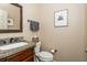 Elegant half bath with granite counters, bronze fixtures, and modern design at 12350 Stevens Creek Dr, Alpharetta, GA 30005