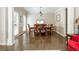Formal dining room boasts hardwood floors, neutral paint, and a large window at 12350 Stevens Creek Dr, Alpharetta, GA 30005