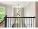Grand foyer with an ornate chandelier and lots of natural light at 12350 Stevens Creek Dr, Alpharetta, GA 30005