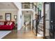 Inviting foyer with hardwood floors, staircase, and views into the formal living areas at 12350 Stevens Creek Dr, Alpharetta, GA 30005